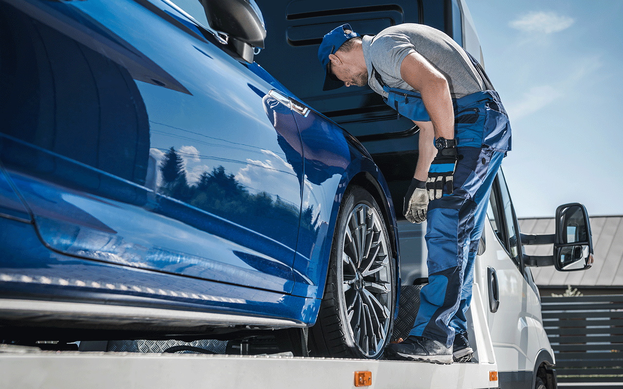 a vechicle courier checking car transportation